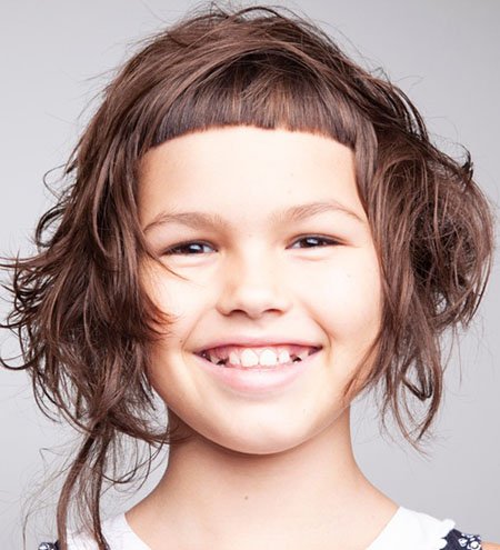 Little Girl With Bangs and Curly Hair